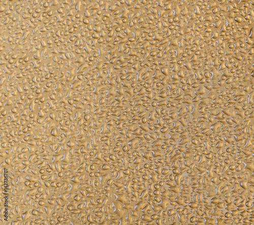 Abstract water drops on a gold background