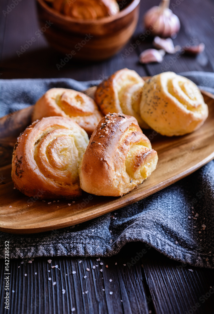 Baked savory bread rolls stuffed with garlic Baked savory bread rolls stuffed with garlic