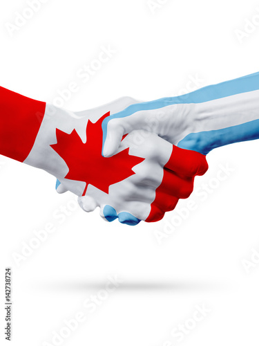 Flags Canada, Argentina countries, partnership friendship handshake concept.