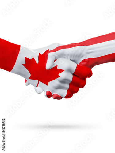 Flags Canada, Austria countries, partnership friendship handshake concept.