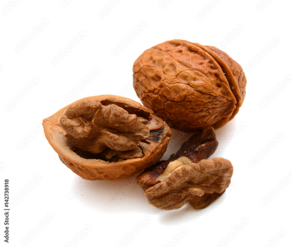 Cracked walnuts isolated on white background Cracked walnuts isolated on white background