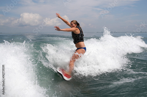 Girl Wakesurfer about to Fall
