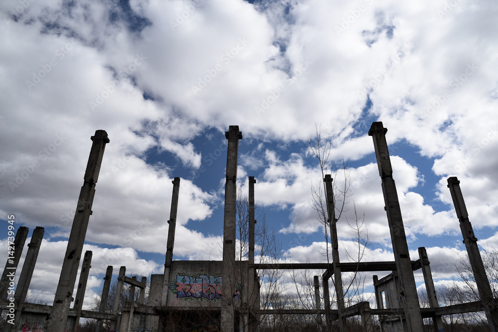 Abandoned Soviet concrete construction with crossed poles Abandoned Soviet concrete construction with crossed poles