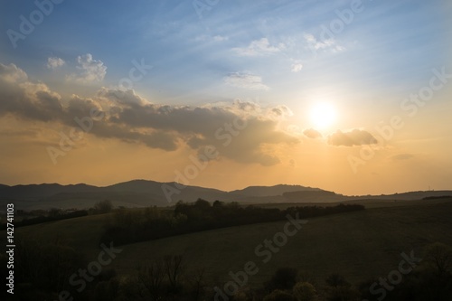 Sunset on meadow with hills and tree. Slovakia © Valeria
