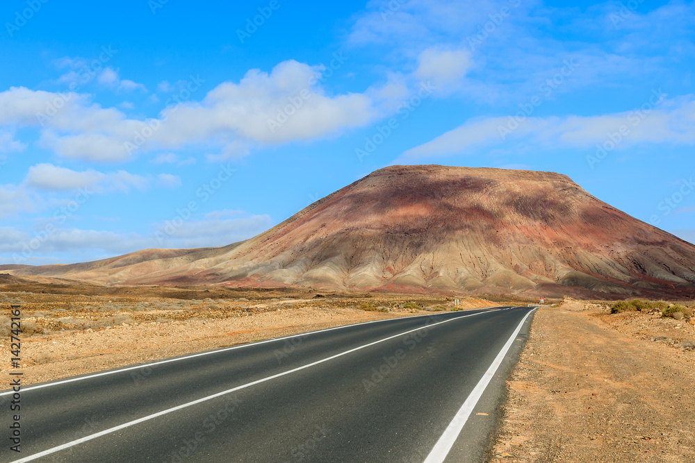 Road to Corralejo along desert with volcanoes, Fuerteventura, Canary Islands, Spain