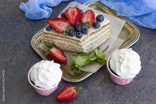 A piece of a diet cake with berries and capcasks. Delicious, healthy dessert. photo