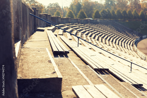 Fototapeta Naklejka Na Ścianę i Meble -  close up of bleachers with benches on stadium