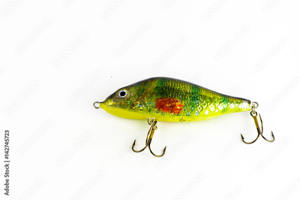 Exhibition of pirated copies of fishing metal spoon baits. Bait for fishing in the shape of a spoon with a hook on a white background Exhibition of pirated copies of fishing metal spoon baits. Bait for fishing in the shape of a spoon with a hook on a white background