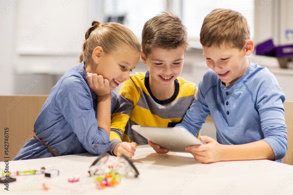 kids with tablet pc programming at robotics school kids with tablet pc programming at robotics school