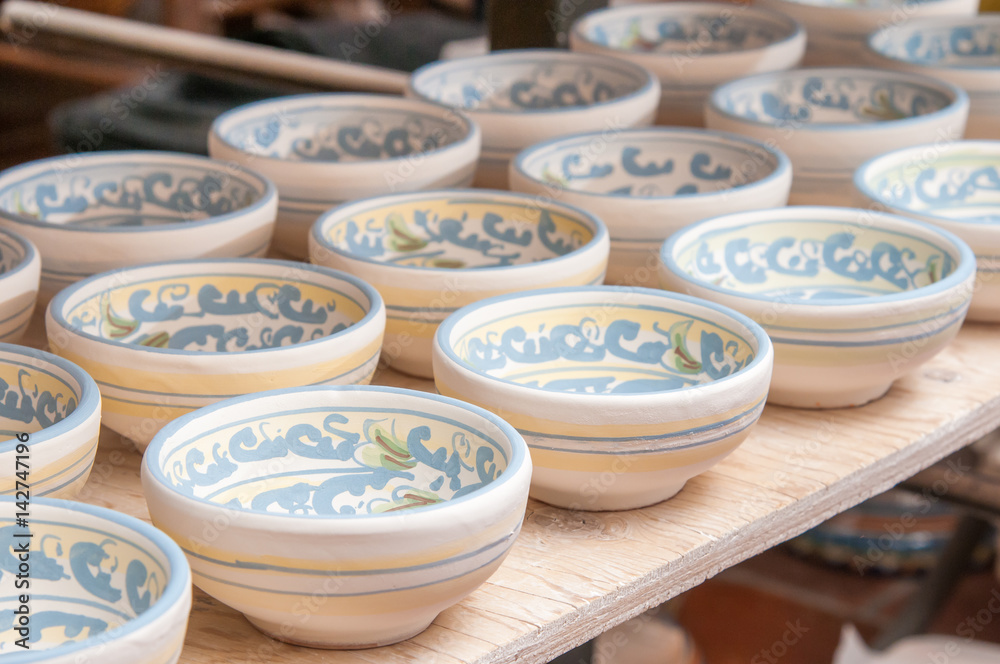 Closeup view of some decorated ceramic bowls in a workshop of Caltagirone, Sicily Closeup view of some decorated ceramic bowls in a workshop of Caltagirone, Sicily