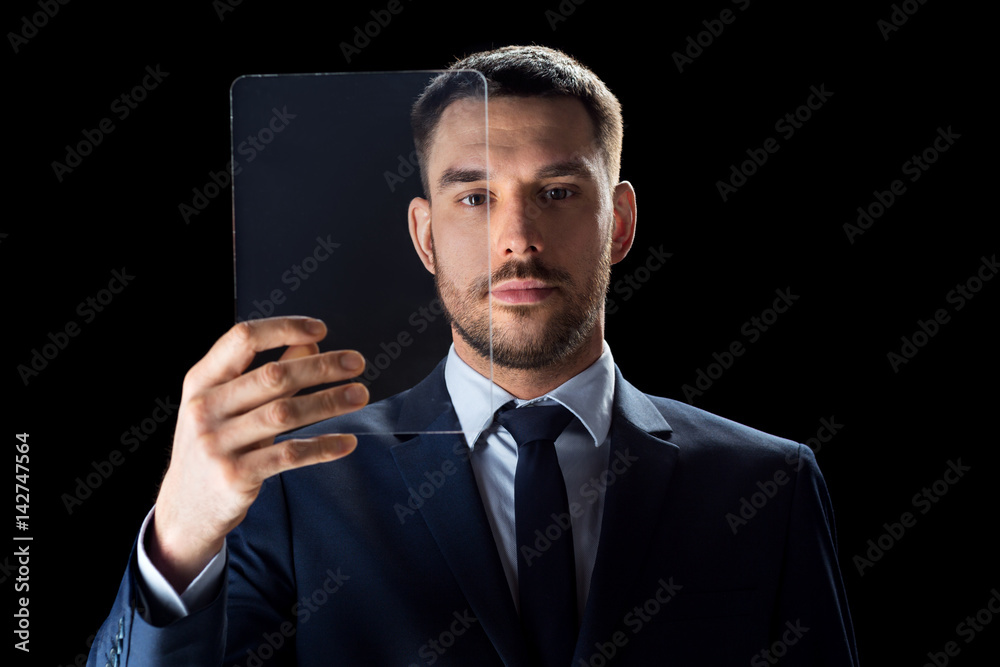 businessman in suit working with transparent tablet pc businessman in suit working with transparent tablet pc
