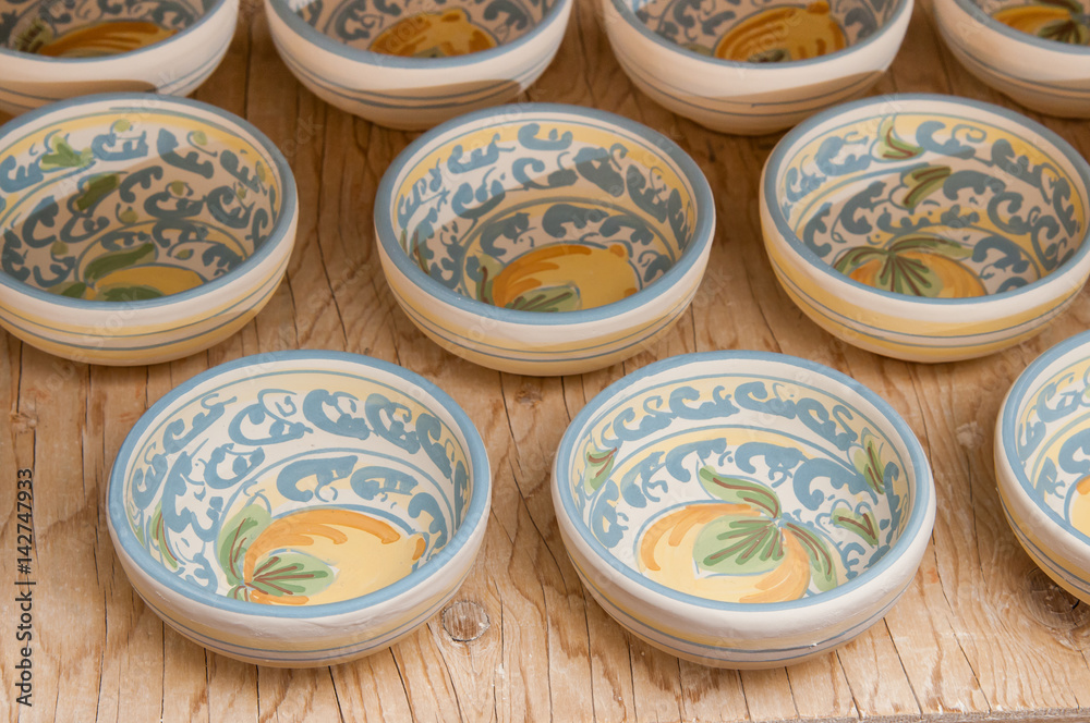 Closeup view of some decorated ceramic bowls in a workshop of Caltagirone, Sicily Closeup view of some decorated ceramic bowls in a workshop of Caltagirone, Sicily