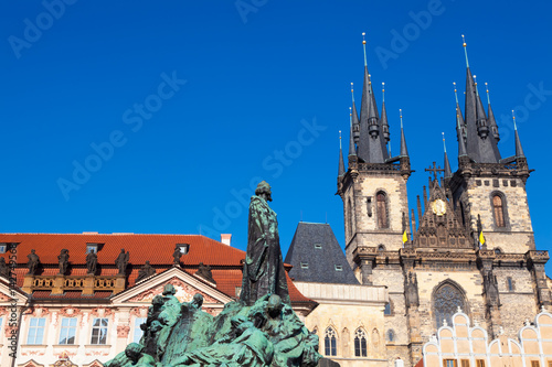 Jan Hus monument and Tyn Church in the Old Town of Prague, Czechia
