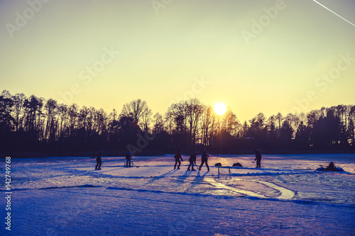 sunset over a frozen lake