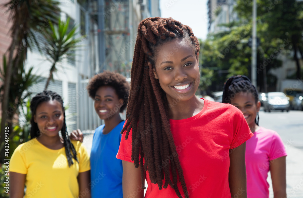 Beautiful african american woman with dreadlocks and other girls Beautiful african american woman with dreadlocks and other girls