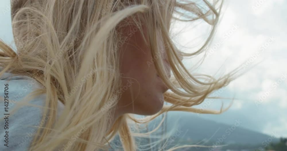 Beautiful girl hair closeup on sailboat in ocean on luxury lifestyle happy adventure travel vacation slow motion