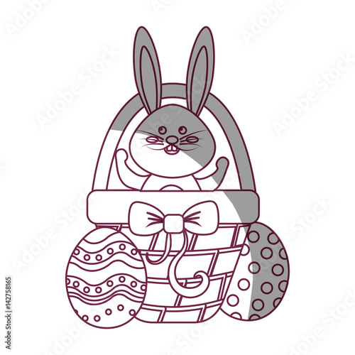 figure rabbit easter inside of hamper and eggs outside