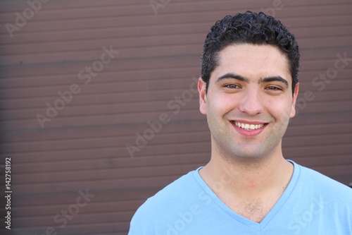 Striking man smiling close up with copy space 