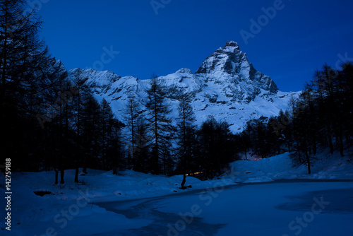 Cervino view from Blue lake in a bright night in winter