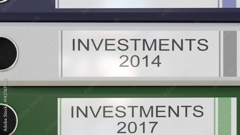 Vertical stack of multicolor office binders with Investments tags different years