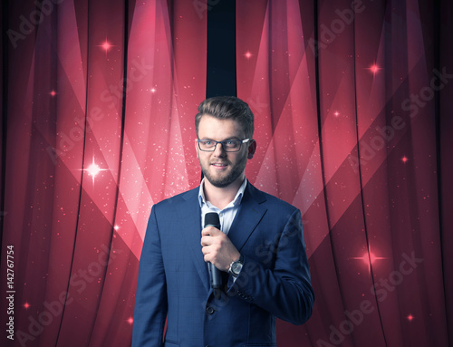 Businessman holding microphone