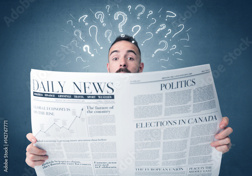 Businessman reading newspaper