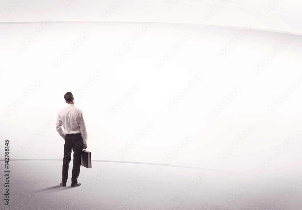 Businessman with briefcase standing still Businessman with briefcase standing still