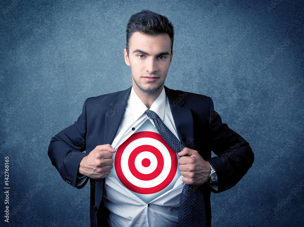 Businessman tearing shirt with target sign on his chest Businessman tearing shirt with target sign on his chest