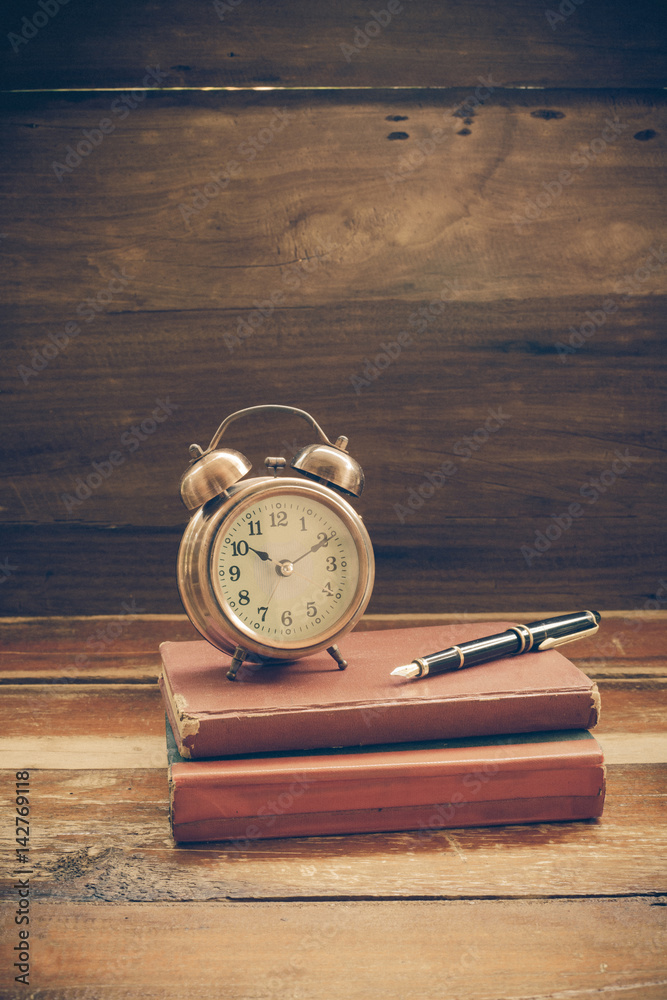 still life alarm clock on old book still life alarm clock on old book