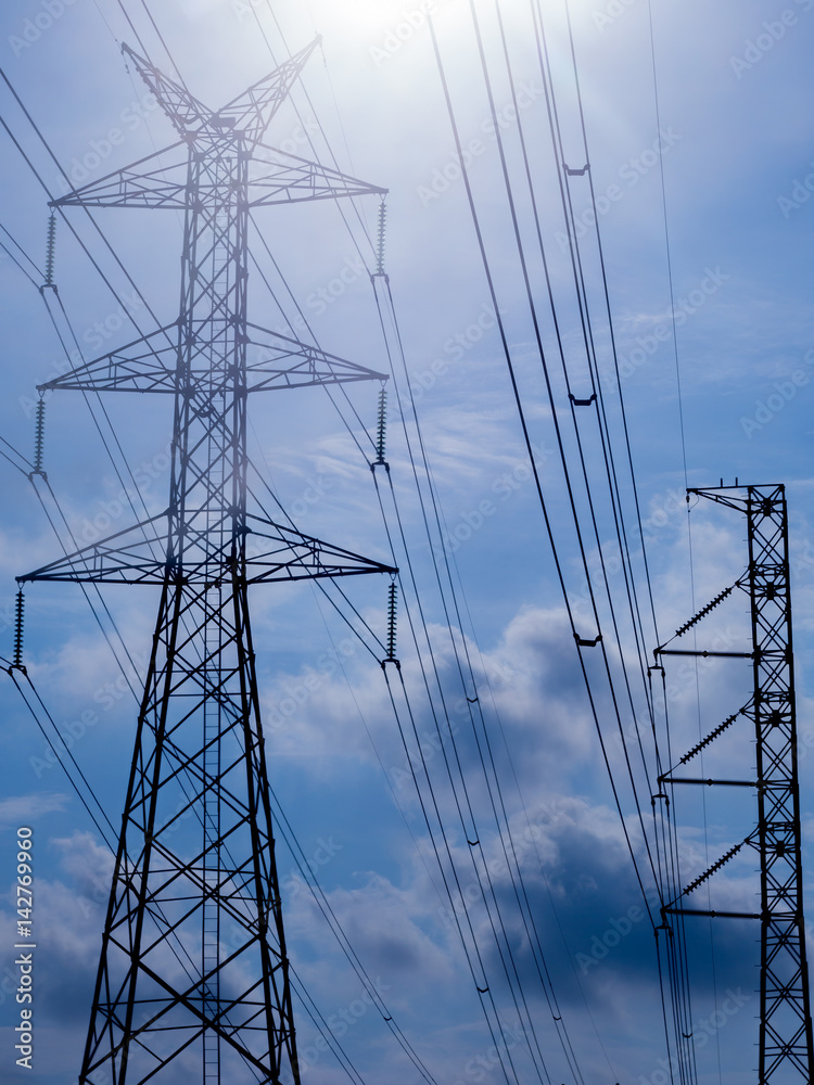 high voltage electric pole isolated in blue sky background