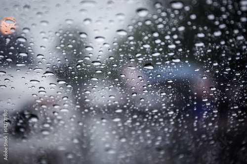 Rain drop on car glass close up background.