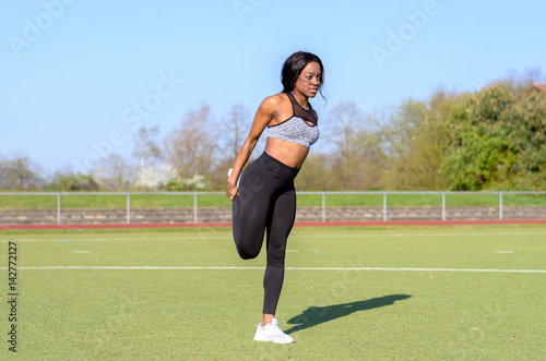 Fit muscular young African woman