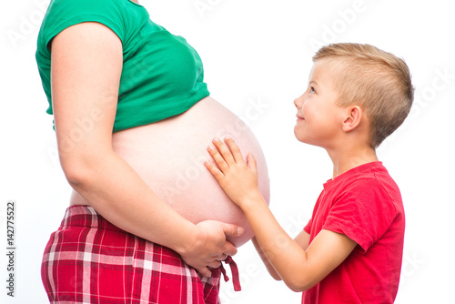 Kid with pregnant mother. isolated on white background