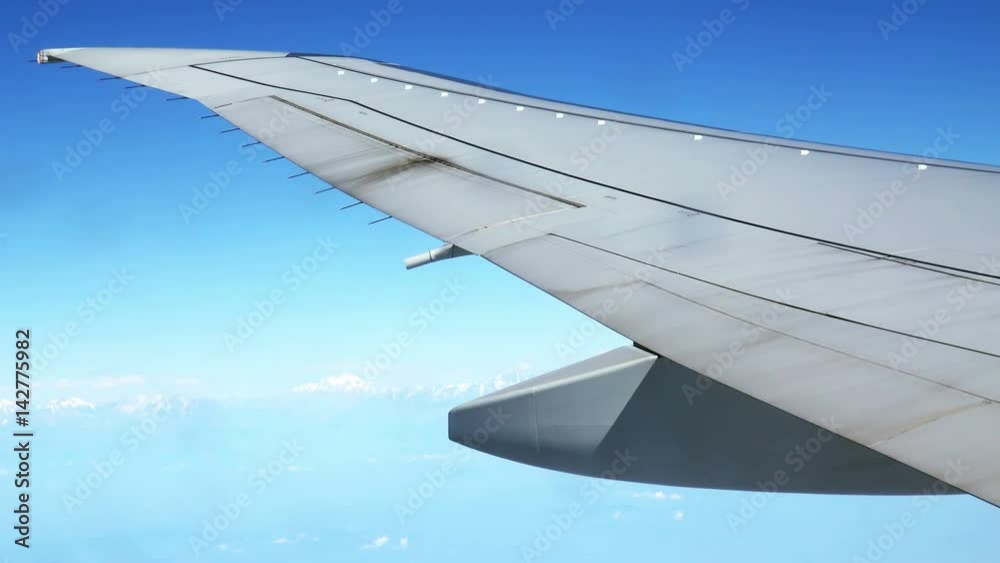 4K Traveling by Airplane at Daylight. View From Airplane Window 4K Traveling by Airplane at Daylight. View From Airplane Window