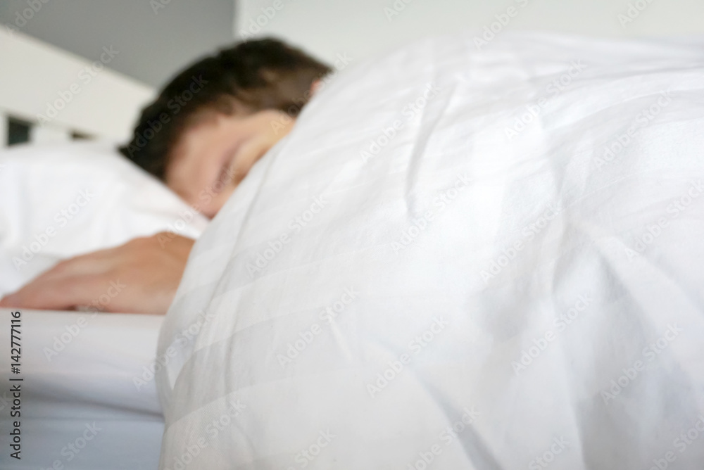 man sleeping in bed with sunlight morning soft background man sleeping in bed with sunlight morning soft background