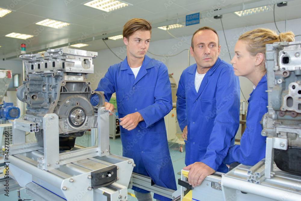 Engineering apprentices with instructor