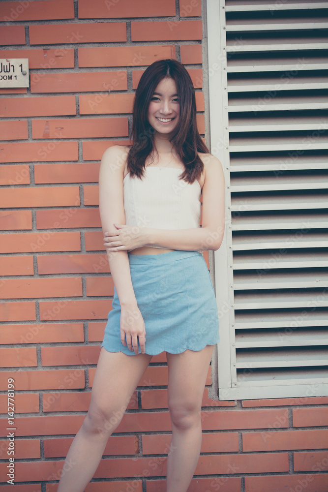 Portrait of thai china adult beautiful girl relax and smile Portrait of thai china adult beautiful girl relax and smile