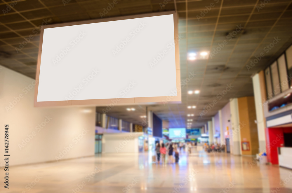 blank billboard with empty copy space in the airport for new advertisement with blurred interior airport background. blank billboard with empty copy space in the airport for new advertisement with blurred interior airport background.