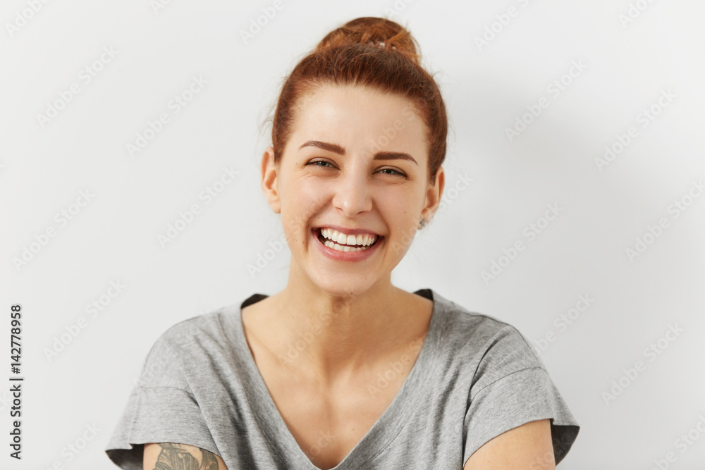 People, youth and happiness . Portrait of beautiful happy Caucasian teenage girl dressed casually smiling broadly, showing her perfect white teeth, enjoying leisure time, spending weekend indoors People, youth and happiness . Portrait of beautiful happy Caucasian teenage girl dressed casually smiling broadly, showing her perfect white teeth, enjoying leisure time, spending weekend indoors