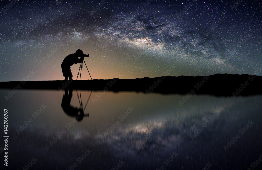 Landscape with Milky way galaxy. Night sky with stars and silhouette Photographer take photo on the mountain. - obrazy, fototapety, plakaty 