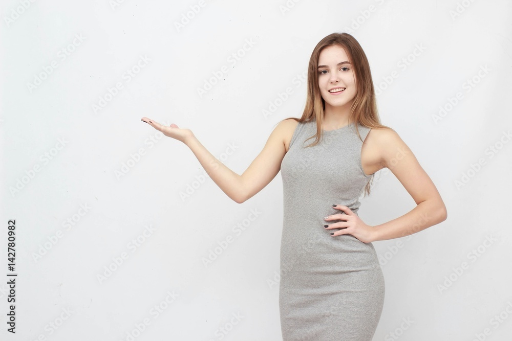 Smiling woman showing open hand palm with copy space for product or text Smiling woman showing open hand palm with copy space for product or text