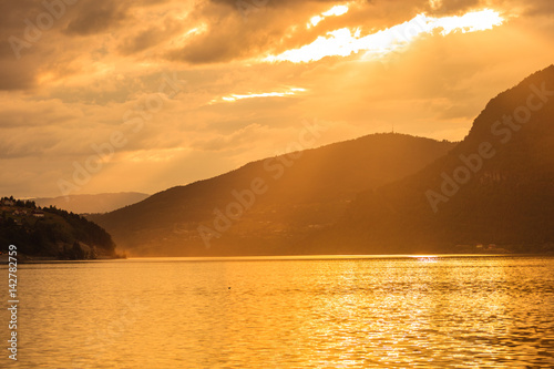 Red sunset over sea fjord Norway