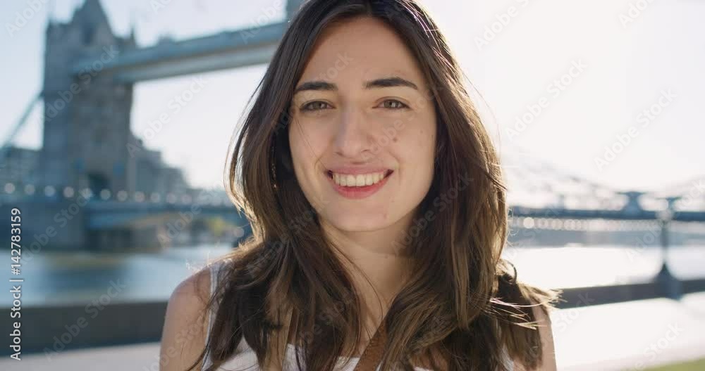 Close up portrait of beautiful young woman smiling laughing hair blowing in wind slow motion Close up portrait of beautiful young woman smiling laughing hair blowing in wind slow motion