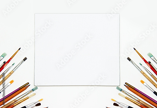 painting equipment and blank white canvas mock up. art Background, brushes photo