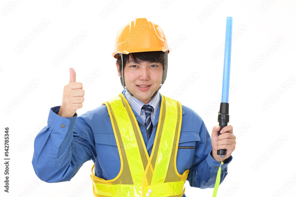 誘導灯を持つ労働者 誘導灯を持つ労働者