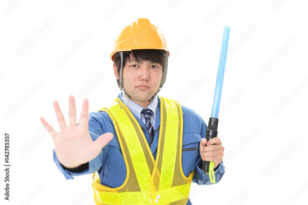 誘導灯を持つ労働者 誘導灯を持つ労働者