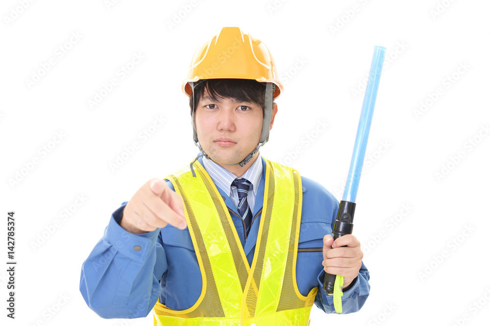 誘導灯を持つ労働者 誘導灯を持つ労働者