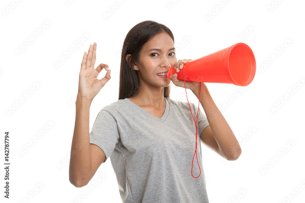 Beautiful young Asian woman announce with megaphone. Beautiful young Asian woman announce with megaphone.