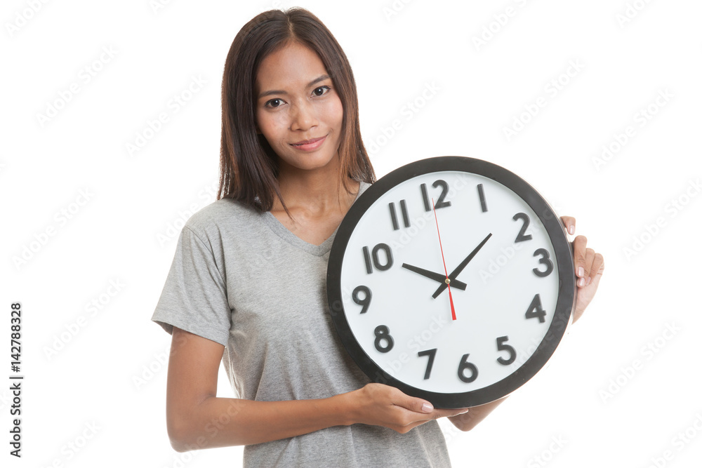 Young Asian woman with a clock. Young Asian woman with a clock.