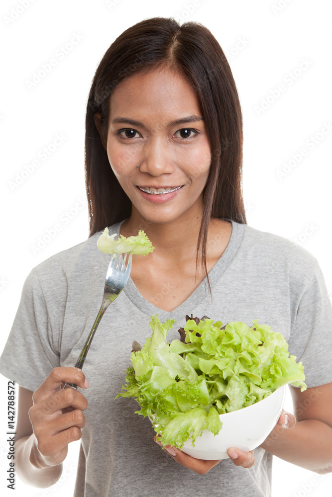 Healthy Asian woman with salad.